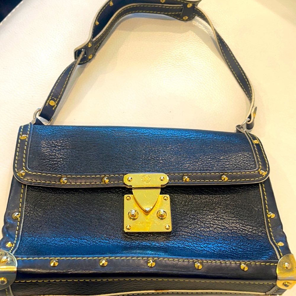 Gently preowned , vintage black  Le Talentuteux mini bag with gold studs .